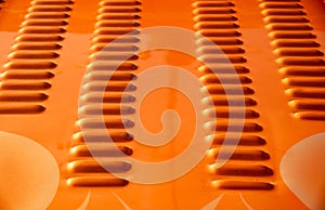 Orange metallic sport car surface background. Abstract details of a sport car engine cover.