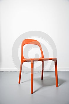 An orange modern chair.