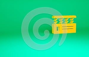 Orange Movie clapper icon isolated on green background. Film clapper board. Clapperboard sign. Cinema production or