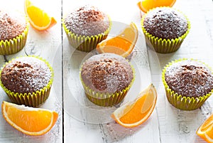 Orange muffins at the table