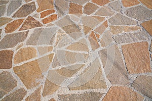 Orange old stone road surface. Seamless Texture. The texture of a stone road