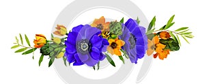 Orange ornithogalum flowers and blue anemones in a floral arrangement