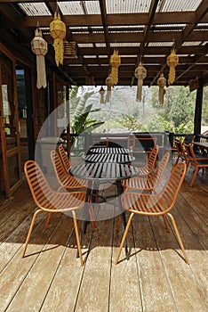 Orange outdoor table and chairs in bistro cafÃ© in daytime for relaxation, travel, season, time, holiday, gastronomy, concept