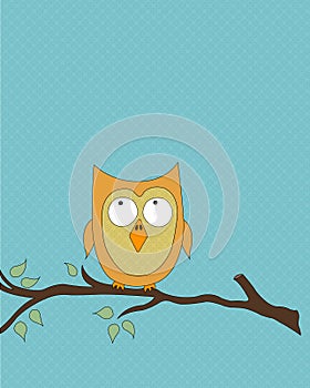 Orange owl on tree branch