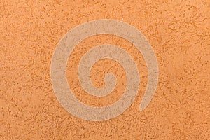 Orange painted stucco wall. Background texture