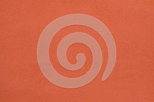 Orange painted stucco wall. Background texture