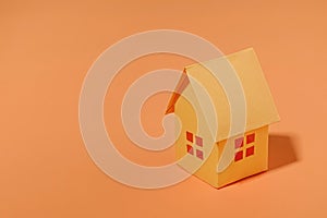 Orange paper house with copy space