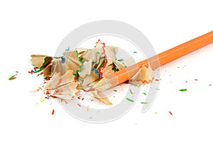 Orange pencil with sharpener shaves