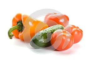 Orange pepper, cucumber and three tomatos
