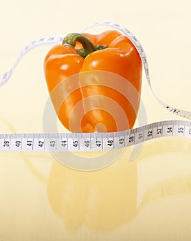 Orange Pepper with Tape Measure