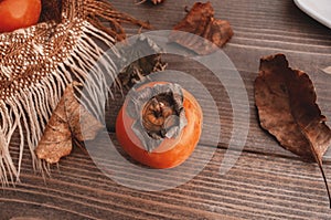 Orange persimmons on wooden table