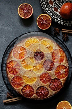 orange pie on a gray table background, delicious treat, food texture, sweet pie for a holiday, juicy oranges, dessert