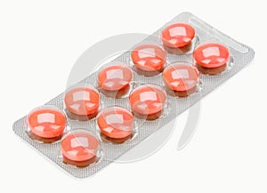 Orange pills in blister (bubble) pack photo