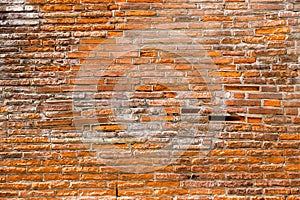 Orange pink old thin bricks work wall. Backgrounds full frame