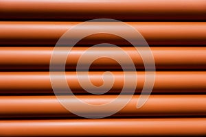 Orange pipe made of polyvinyl chloride