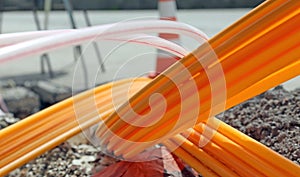 Orange pipes for fiber optics in a large city road construction