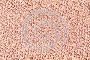 Orange plaster wall texture close-up