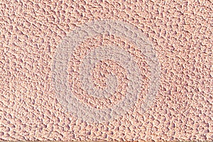 Orange plaster wall texture close-up