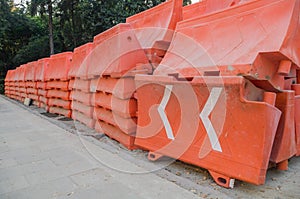 Orange plastic barriers stacked on an avenue in Mexico City.