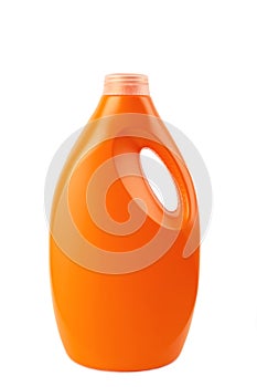 Orange plastic bottle with liquid laundry detergent or cleaning agent or bleach or fabric softener isolated on white background