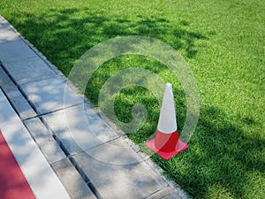 Orange Plastic Cone in Green Grass Soccer Field for Sport Training