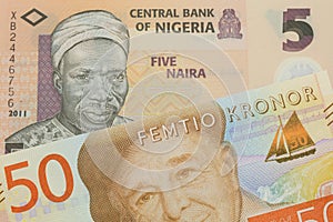A orange, plastic five naira note from Nigeria paired with a gray and orange fifty kronor note from Sweden.