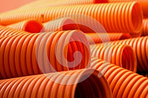 Orange plastic pipes on the construction
