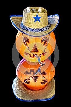 Orange plastic pumpkin with a cowboy hat