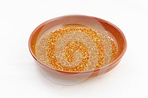 Orange plate or bowl with seed beads for handcraft, making of jewelry, embroidery, female fashion accessories