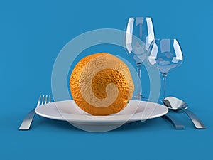 Orange with plate and cutlery