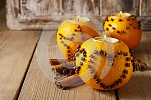 Orange pomander ball with candle