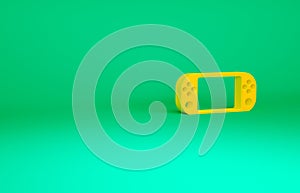 Orange Portable video game console icon isolated on green background. Gamepad sign. Gaming concept. Minimalism concept