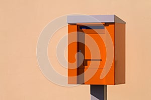Orange post box. mailbox. isolated over the light background