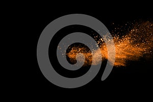 Orange powder explosion on white background.