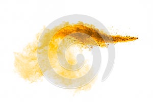 Orange powder splattered on white background.Abstract design of color dust cloud