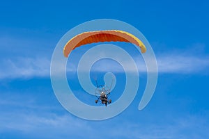 Orange powered tandem para glider flying