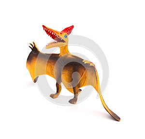 Orange pterosaurs toy on white background