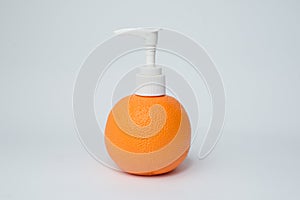 Orange pump lotion bottle