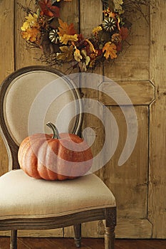 Orange pumpkin on chair