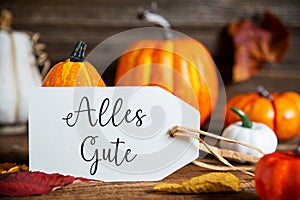 Orange Pumpkin Decoration With Label With German Text Alles Gute, Which Means Best Wishes in English