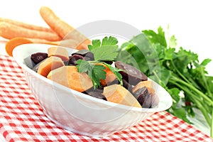 Orange and purple carrots with parsley
