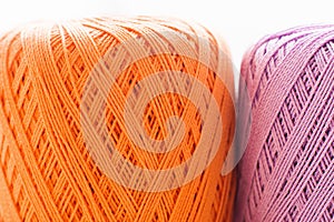 Orange and purple knitting thread background