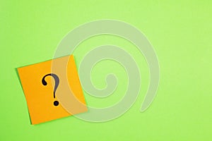 Orange Question Mark on Green Background