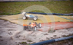 Orange RC buggy accelerating from a corner