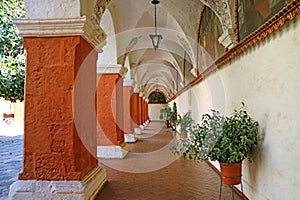 Orange Red Corridor Columns and Wall Fresco Paintings in the Monastery of Santa Catalina, Historical site in Arequipa, Peru