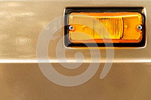 Orange reflectors on the car. Light reflectors on the hood of the truck for safe driving on the road. Car detail, close-up.