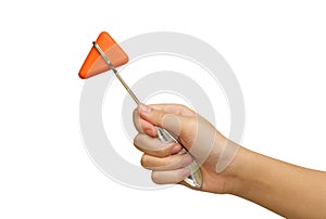 Orange reflex hammer in doctor's hand