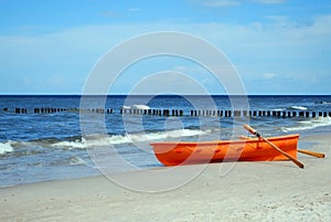 Orange rescue boat on a beach