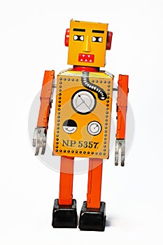 Orange retro robot wind up toy.