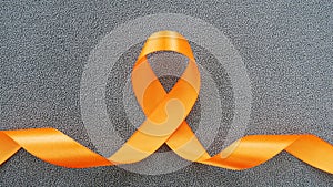 Orange Ribbon for Healthcare and World cancer day concept.